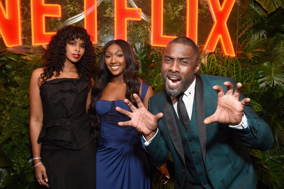 Idris attended the bash with fiance Sabrina Dhowre [L] and daughter Isan [C]