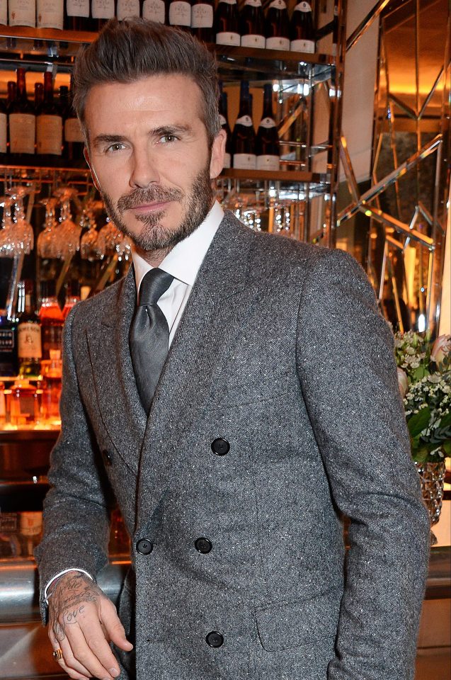  David Beckham adorned a grey tweed blazer and matching trousers