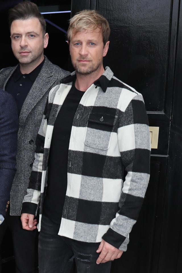  Meanwhile Kian Egan wore a bold black and white check shirt