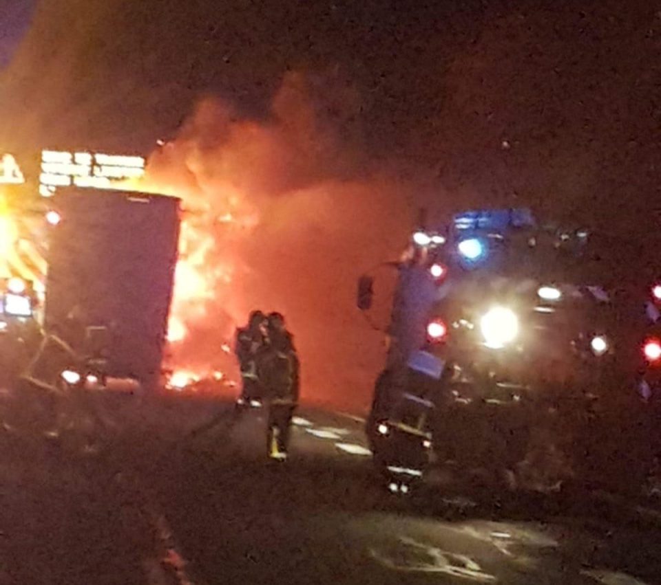  Rioting migrants set a lorry on fire to create a roadblock in the port of Calais