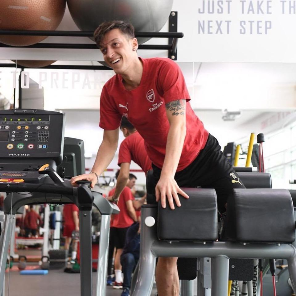  Mesut Ozil was in good spirits in an indoor training session - but that smile might not be there if he is benched again