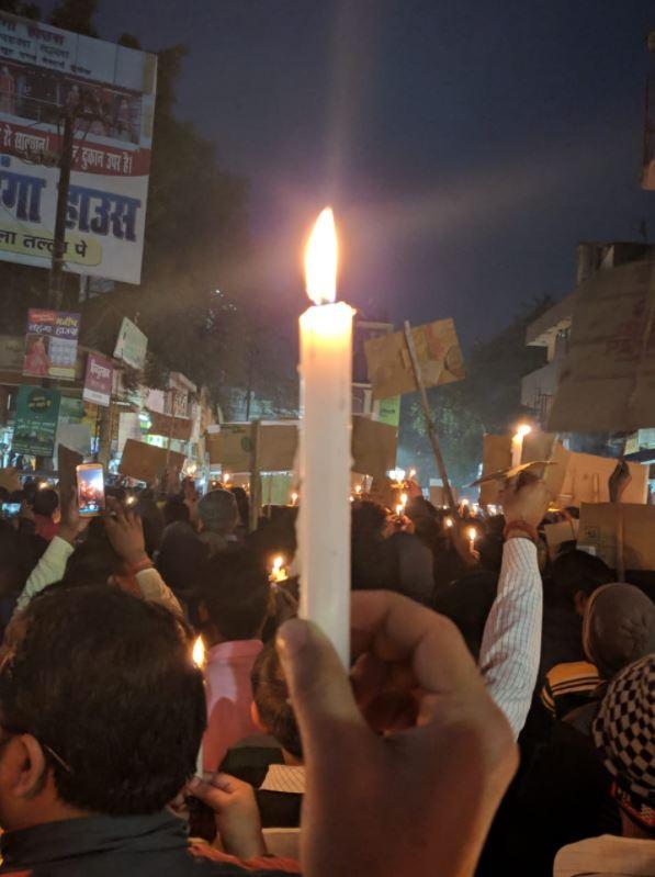  A protester holds a candle during vigils held twice this week