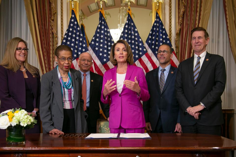  Speaker of the House Democrat Nancy Pelosi participating in an enrollment ceremony for legislation that will ensure backpay to furloughed federal employees