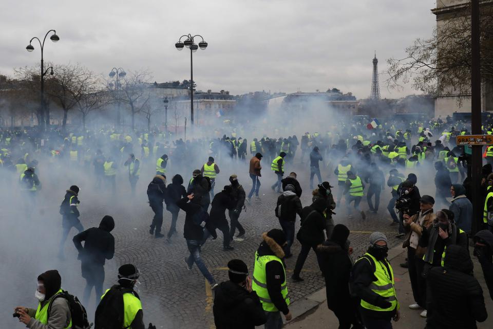  Police released tear gas smoke during an yellow vest anti-government demonstration in Paris on Saturday