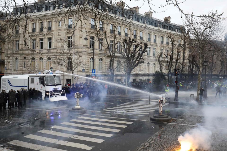  Cops unleashed water cannons at militant yellow-vest protesters after being pelted with stones and paint