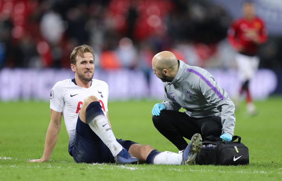  Harry Kane received treatment on the pitch after he was caught by Phil Jones