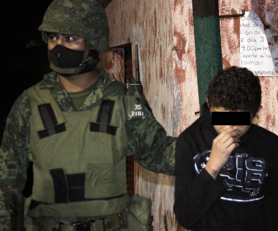 Pictured is a 14-year-old accused of operating as a hitman for a Mexican drug cartel