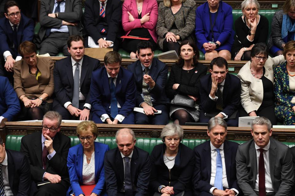  Prime Minister Theresa May and Conservative MPs listening to Labour leader Jeremy Corbyn speaking after she lost a vote on her Brexit deal