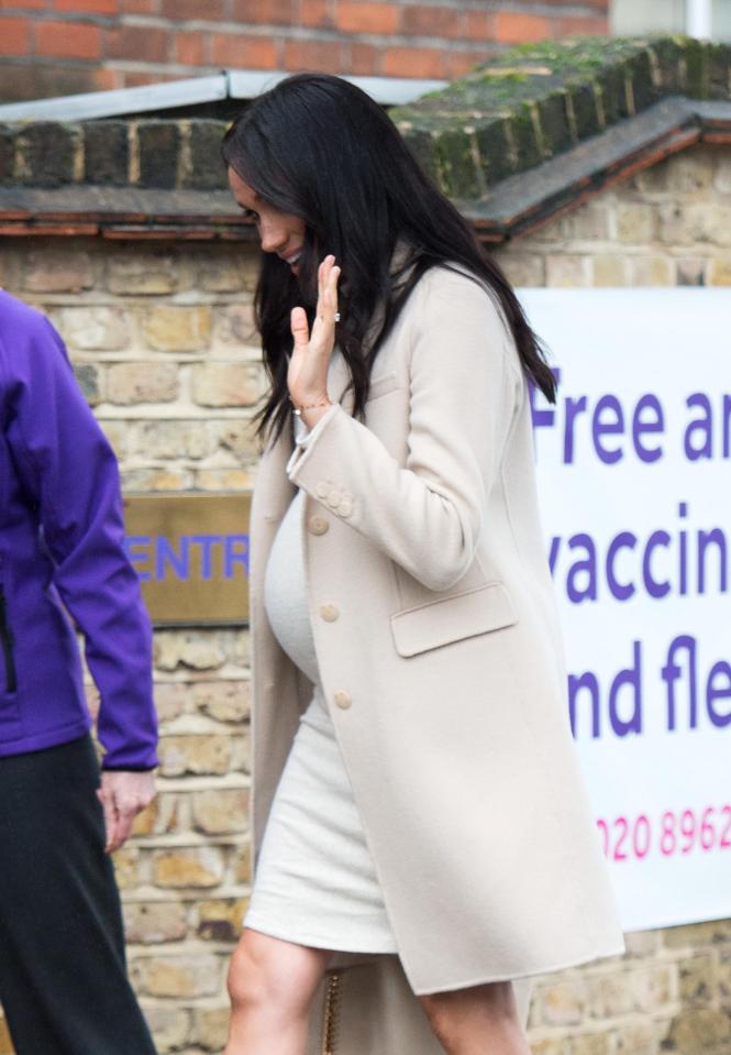  The 37-year-old waved as she walked in to visit the charity