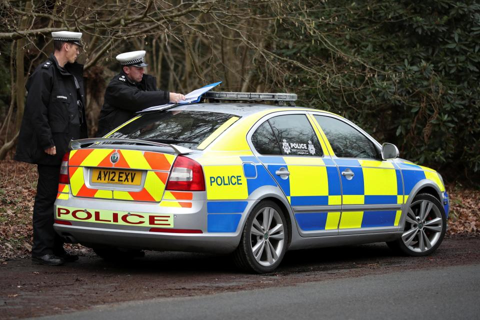  Police officers are seen at the scene where Britain's Prince Philip was involved in a traffic accident