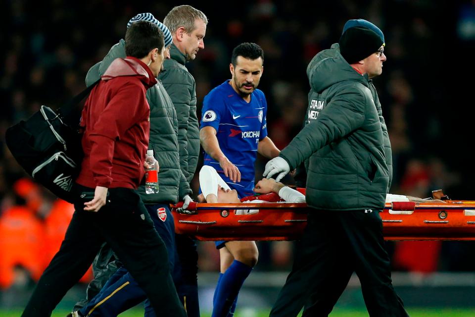  Pedro consoles his Spain team-mate Hector Bellerin as he is carried off