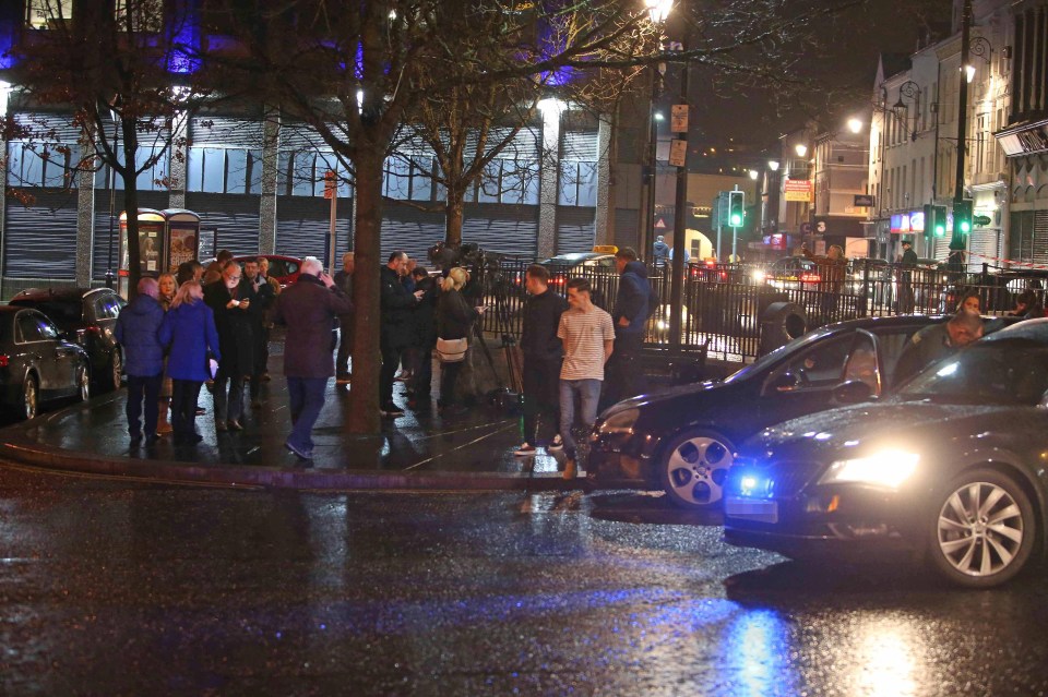 A small crowd gathered at the scene as the police sealed off the area