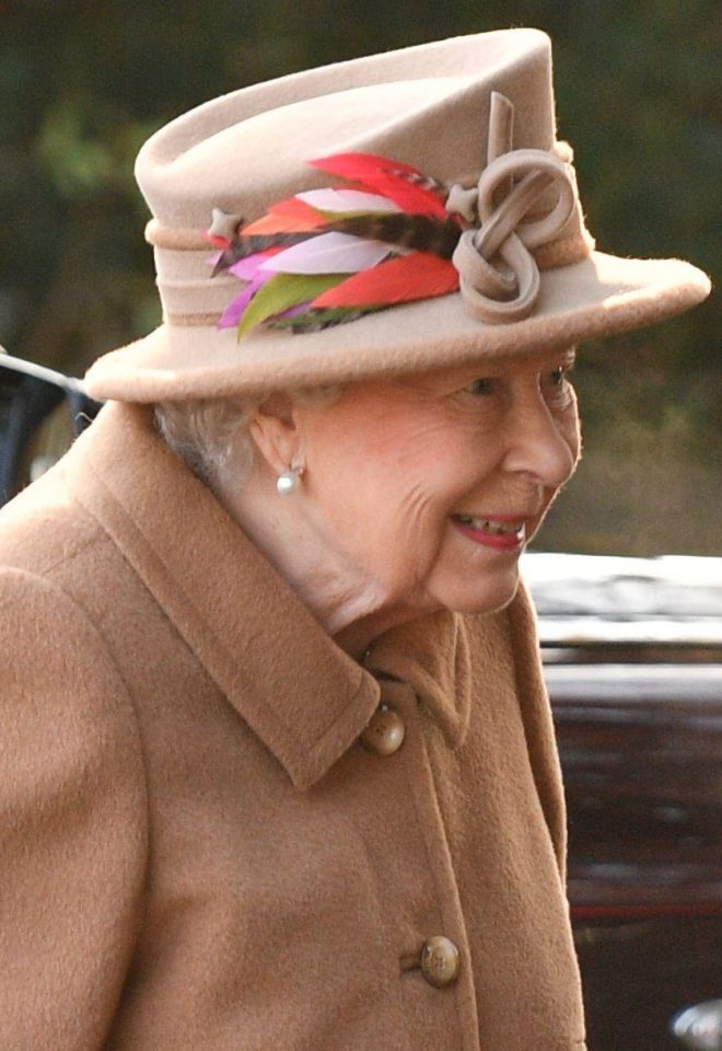  The Queen, 92, wore a warm, camel-coloured coat and hat decorated with colourful feathers