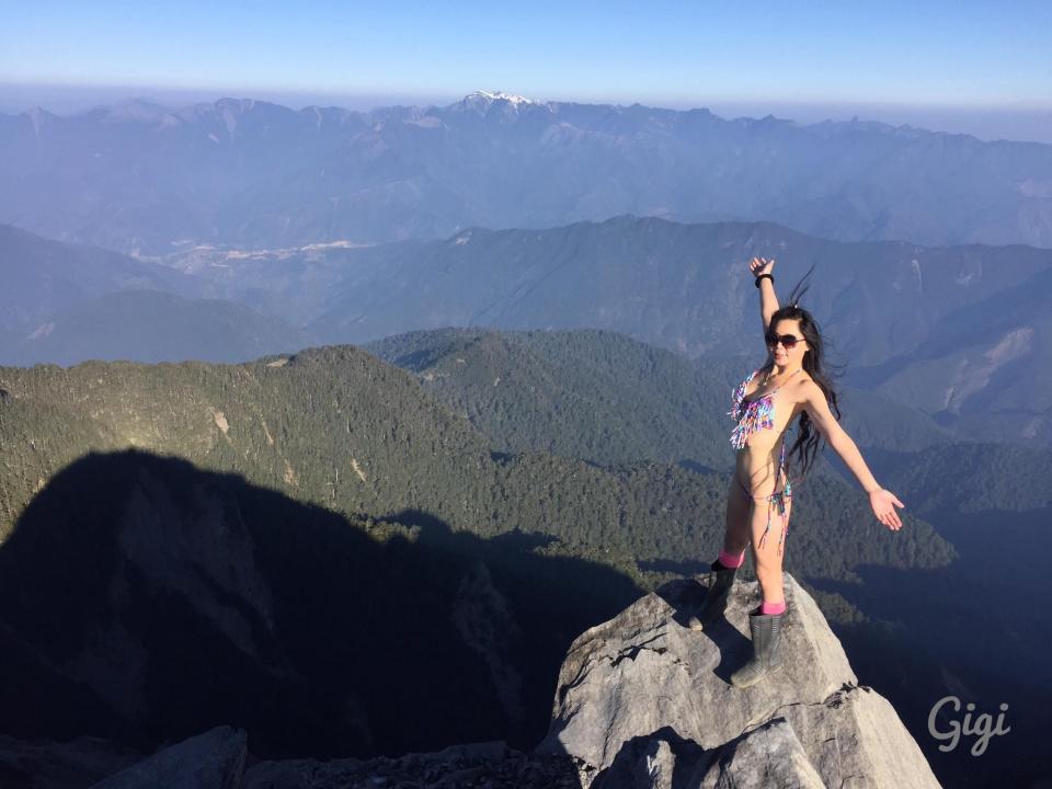  Here she is pictured in a bikini after scaling a huge mountain