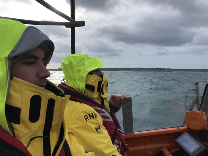  Members of the RNLI search for the missing plane today