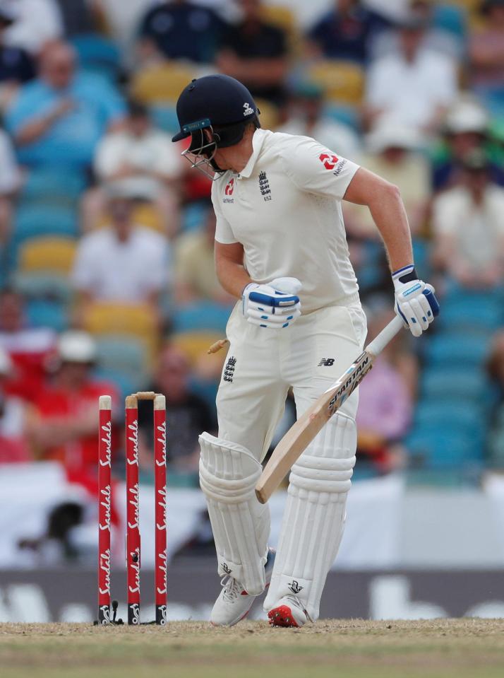  Jonny Bairstow looks behind at his broken stumps after being clean bowled