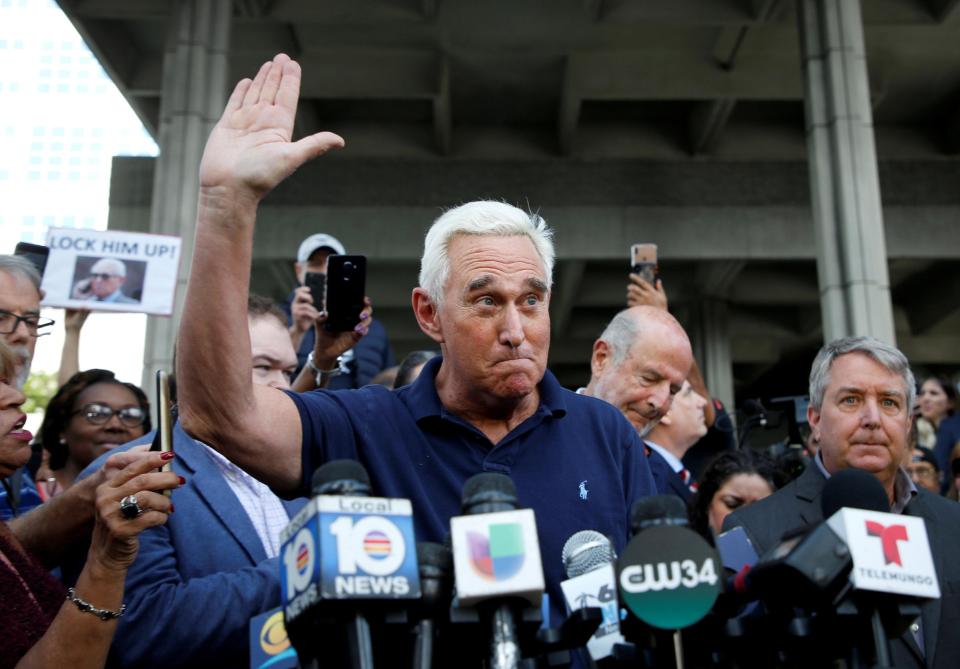  Stone vowed to fight the charges as protesters shouted 'lock him up'