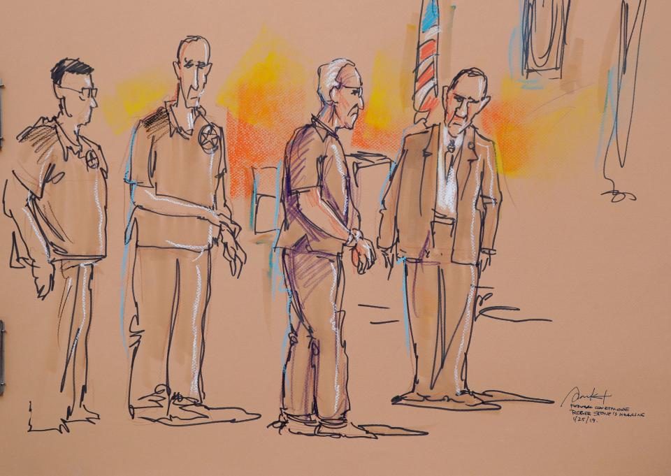  A court sketch shows stone in handcuffs. He is out on bail