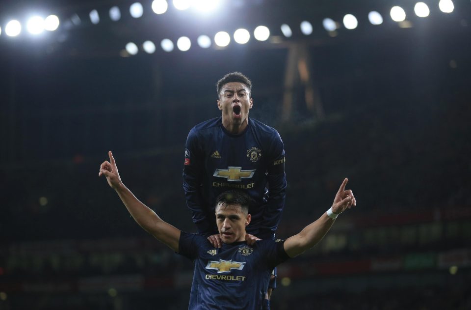  Jesse Lingard celebrates with Alexis Sanchez after the Chilean opened the scoring against Arsenal