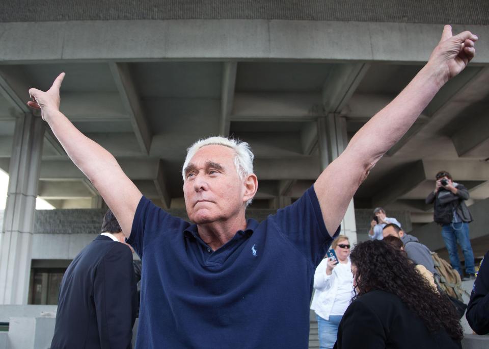  Longstanding Trump ally Roger Stone performed a double v-sign pose outside court after being charged as part of the Russia 'collusion' probe