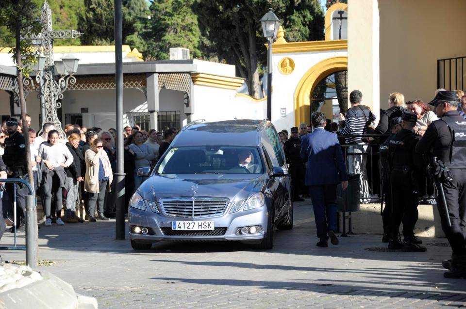  Mourners lined the streets as his body was taken to a funeral home this afternoon