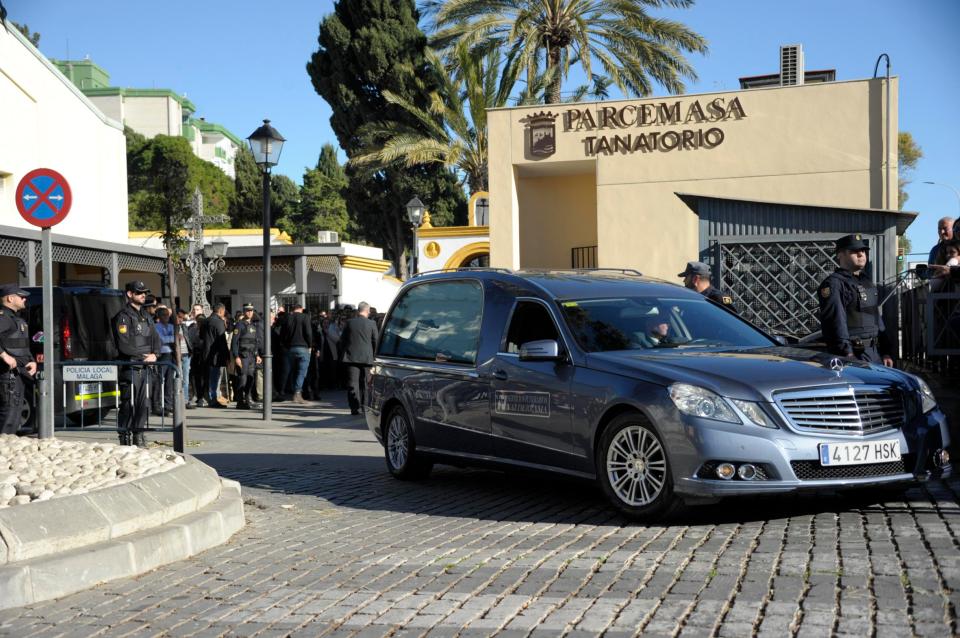  Cops stood by in solemn silence as the hearse rolled past