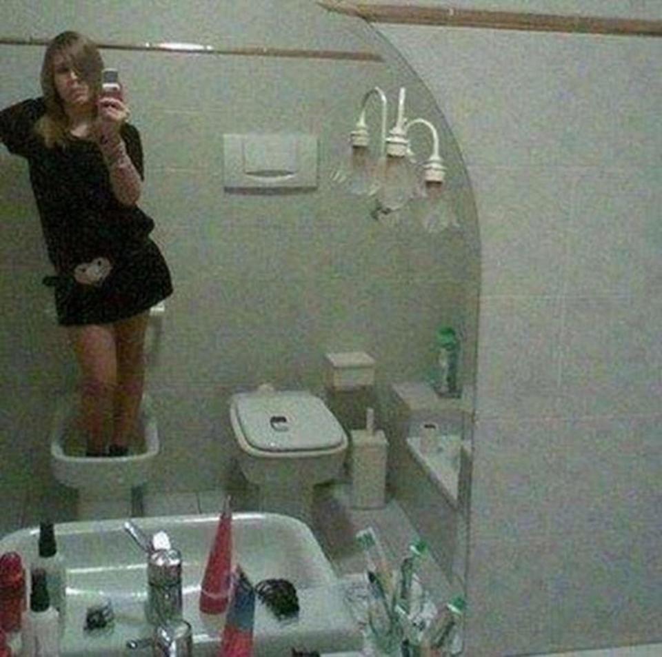  This girl found an interesting place to stand for her bathroom selfie