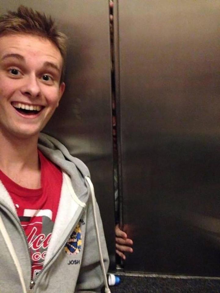  This boy captured someone sneaking out of a cupboard behind him