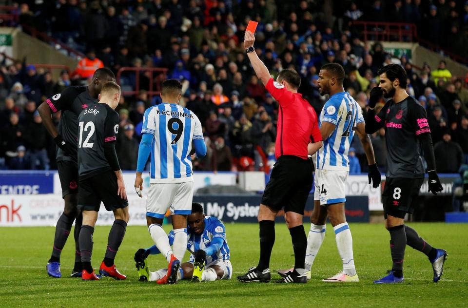  Referee Stuart Attwell shows Lucas Digne his marching orders