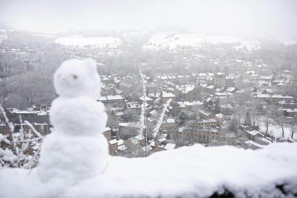  Views over the snow-covered village of Uppermill yesterday afternoon