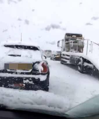  Queues of car built up on the A30 in Devon during rush hour this evening as a result of a crash due to the heavy snow