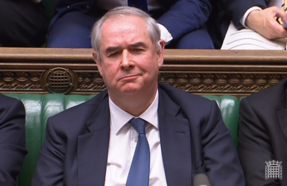  Attorney General Geoffrey Cox reacts during a debate at the House of Commons parliament in London, March 12