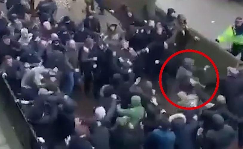  Footage taken of the mass brawl appears to show the Everton fan backing away clutching his face