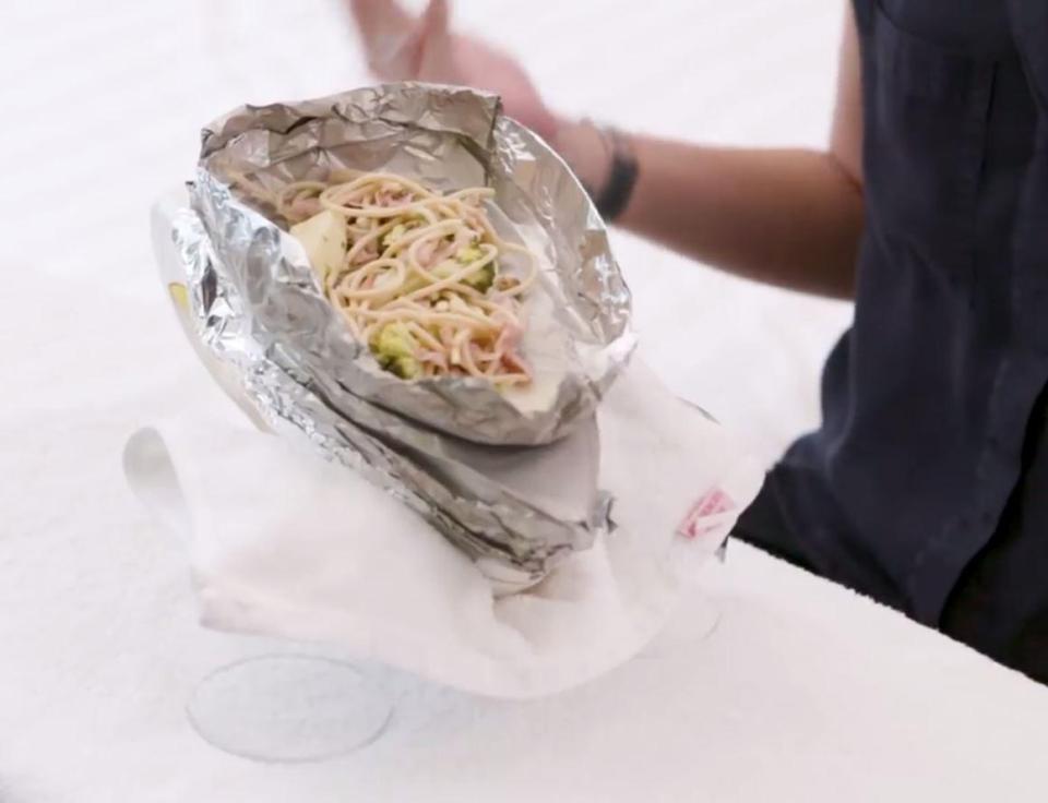  Using a foil tray that she made, she was able to heat up leftovers