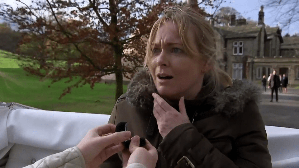  The vet looks shocked at the surprise proposal