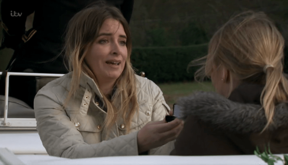  Charity got down on one knee in the back of a horse-drawn carriage