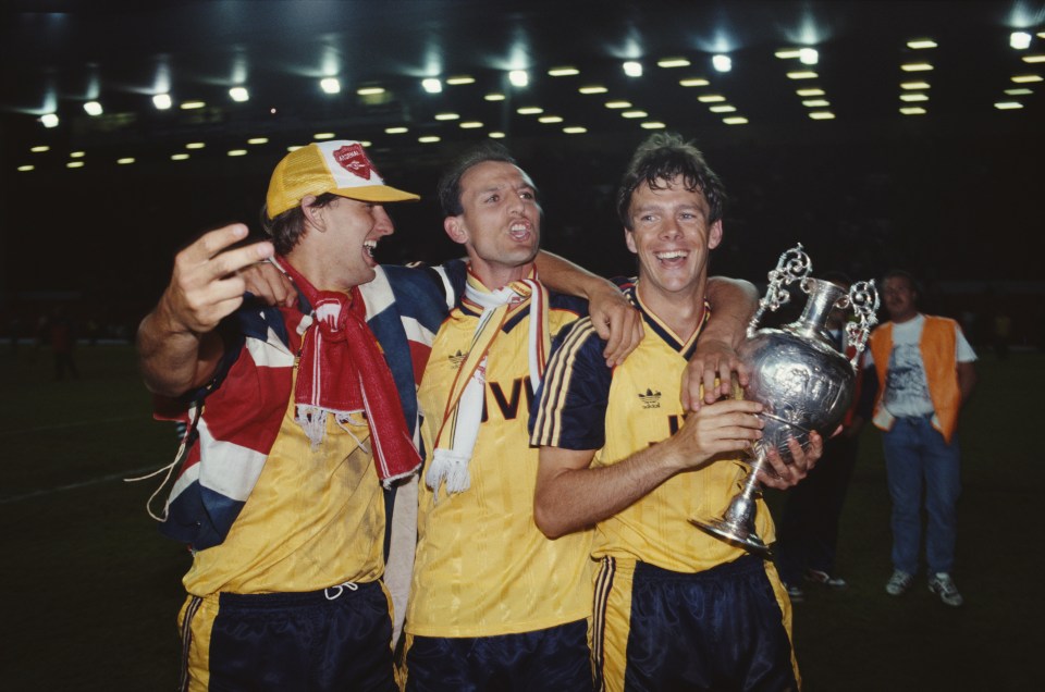  Tony Adams, Steve Bould and David O'Leary celebrate with the First Division trophy in 1989