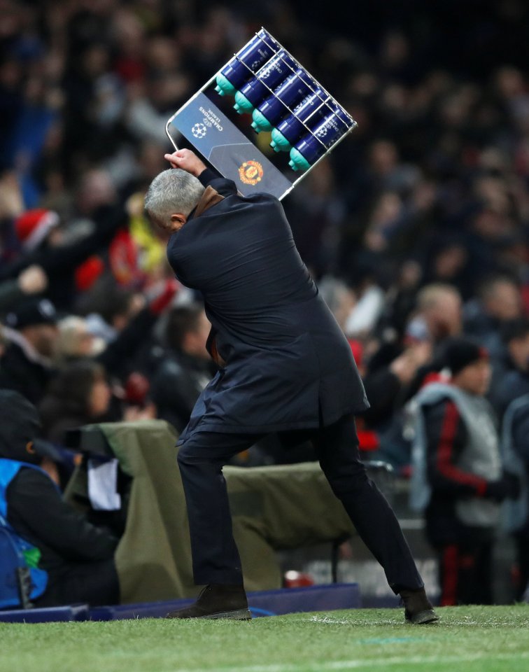  Jose Mourinho launches a crate of water bottles in celebration at a late Man United winner