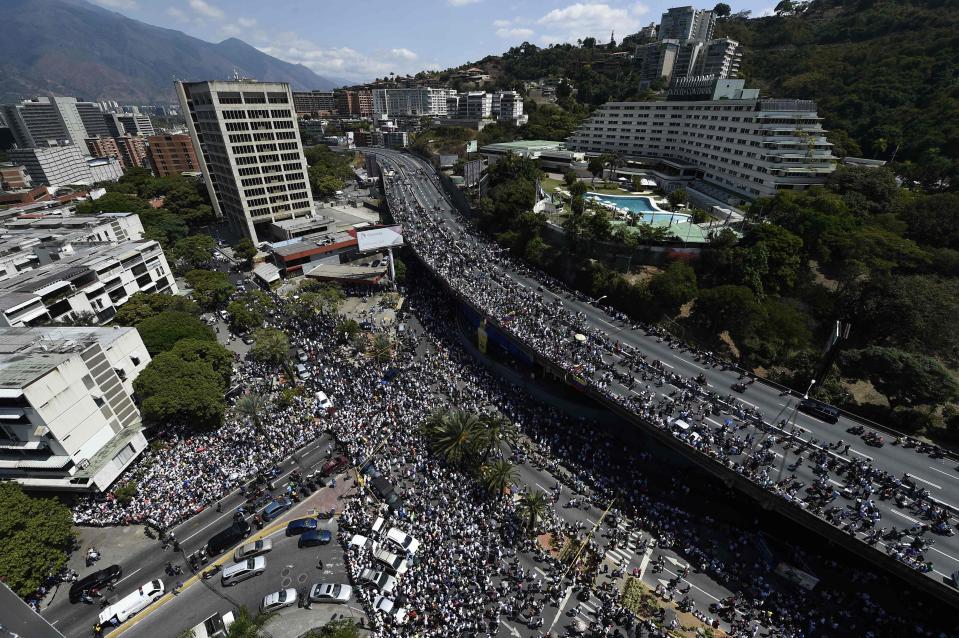  Thousands of supporters flocked to the streets of Caracas to back Mr Guaido over the weekend