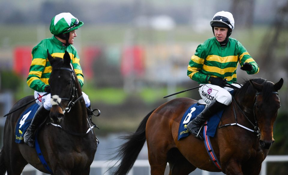  Jockey Mark Walsh (right) on Sir Erec, is congratulated by runner-up Barry Geraghty on Gardens of Babylon