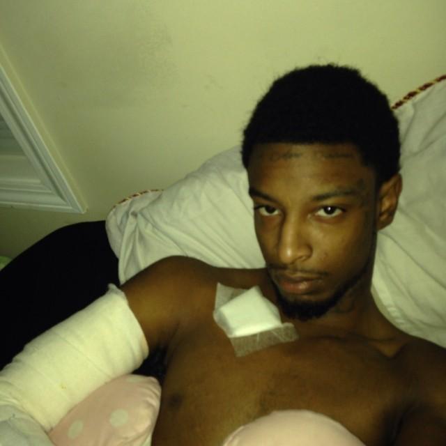  A image posted on Instagram shows the rapper bandaged in bed