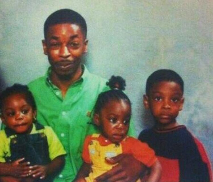  21 Savage (right) as a young boy in London pictured with his father Kevin and twin sisters