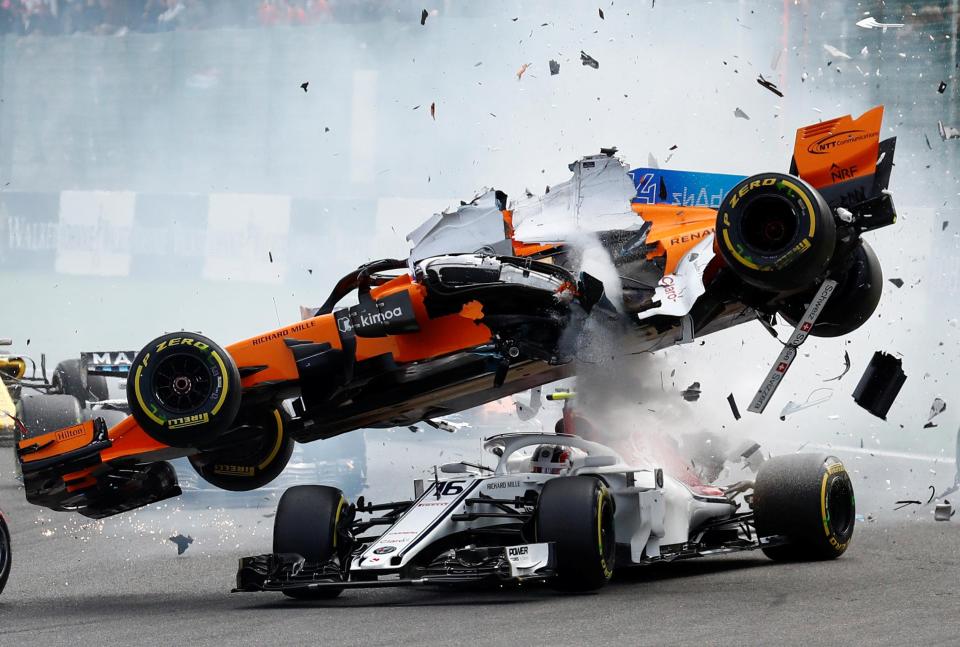  McLaren's Fernando Alonso and Sauber's Charles Leclerc crash at the first corner during the Belgian Grand Prix in Spa-Francorchamps, Belgium, August 26, 2018