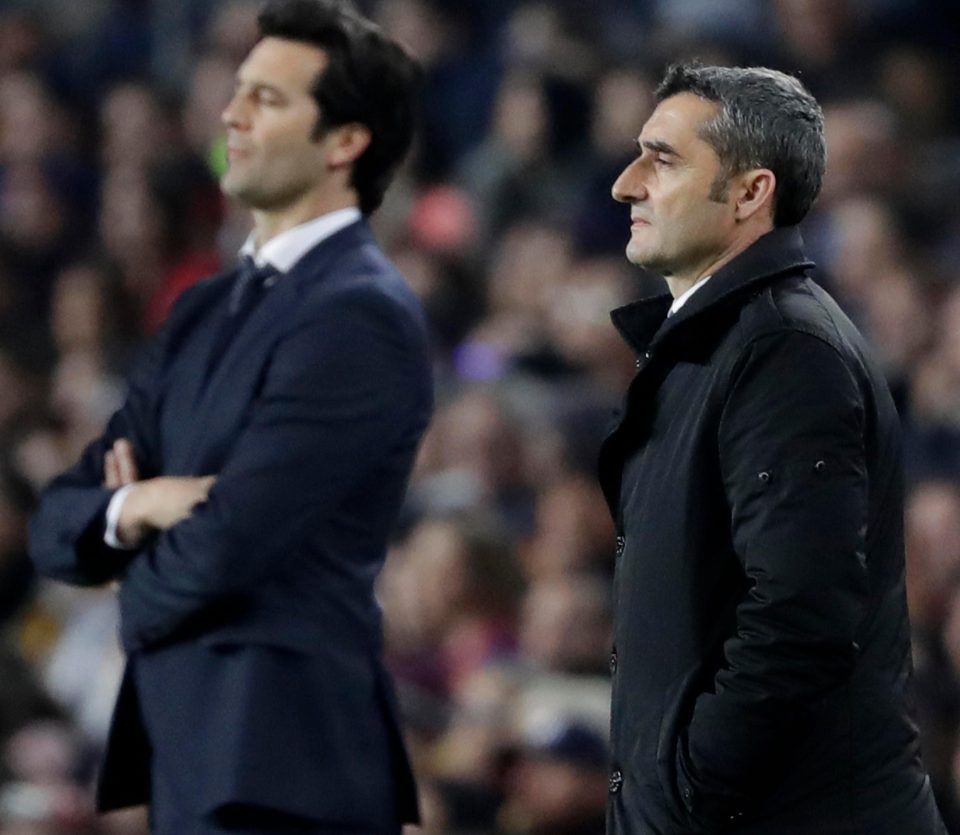  Barcelona boss Ernesto Valverde, right, watches on concerned - with Real chief Santiago Solari also surveying a tight first-half