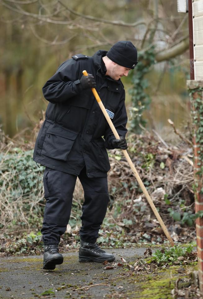  Police officers search in Hull near the home of the suspect arrested over the disappearance of student Libby Squire