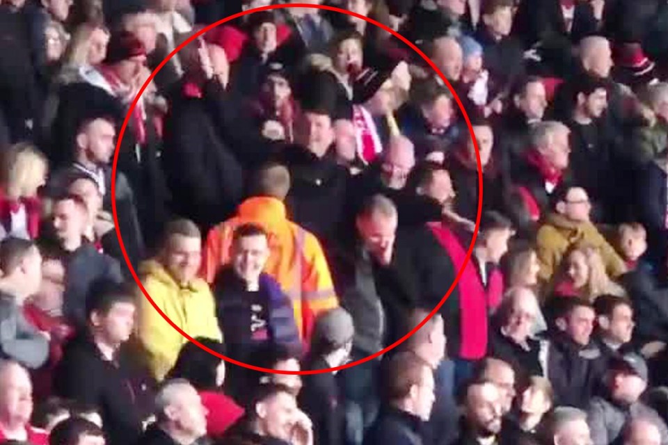 A Southampton fan can be seen making plane gestures aimed towards Cardiff supporters