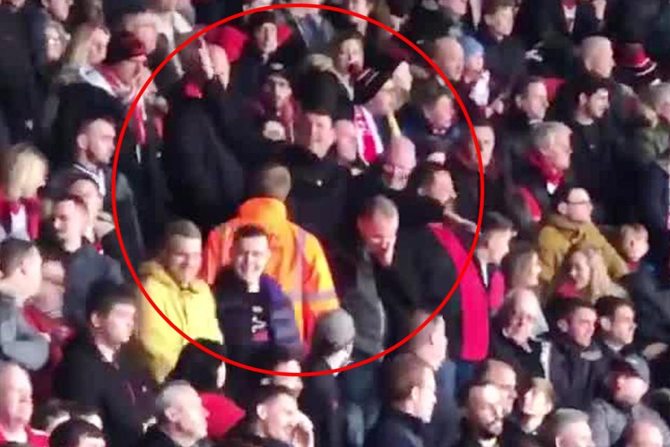  A Southampton fan can be seen making plane gestures aimed towards Cardiff supporters