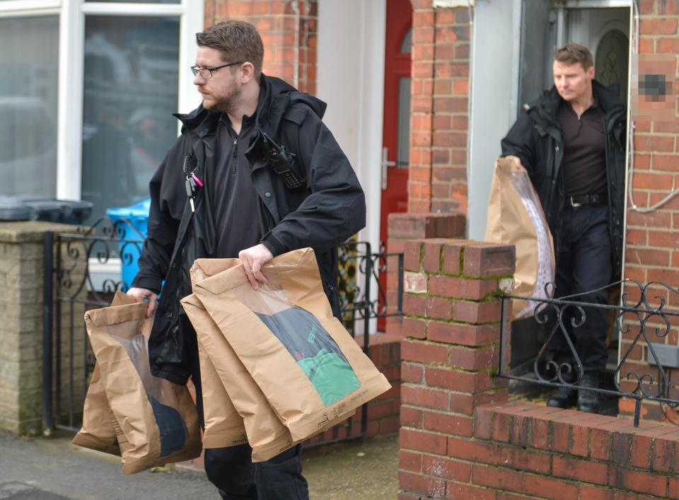  They were seen removing evidence bags and have seized his laptop computer