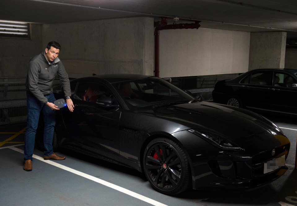 Car security expert Peter Thompson uses the device on a Jaguar