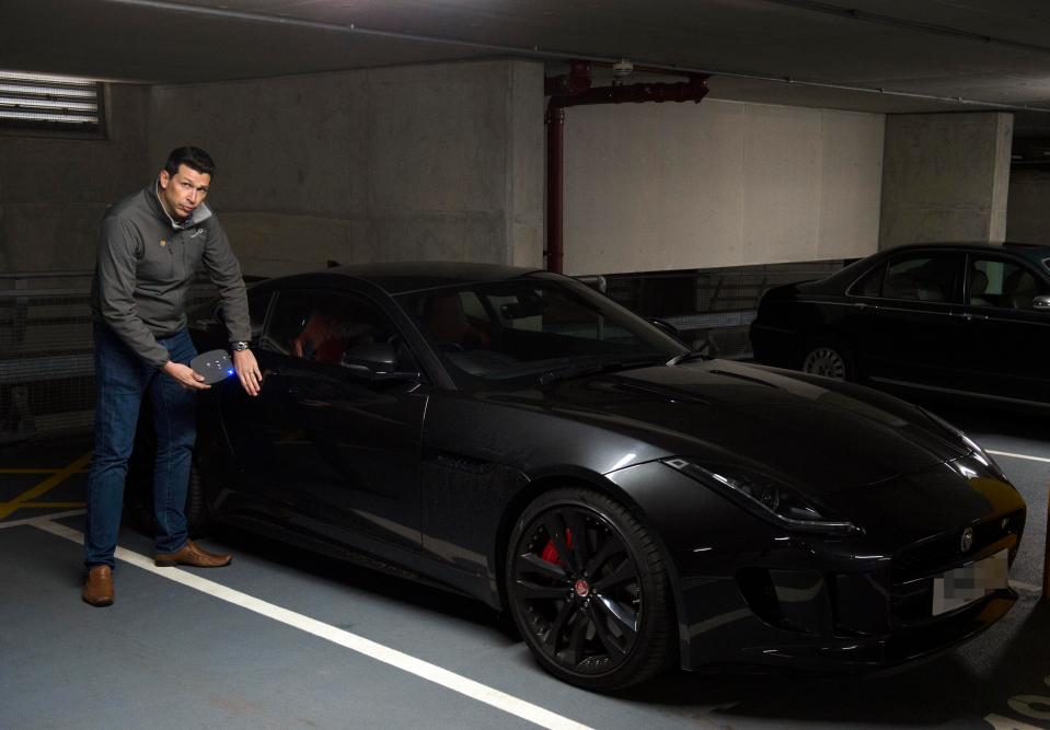  Car security expert Peter Thompson uses the device on a Jaguar